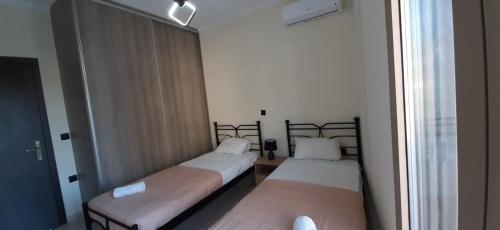 Katil atau katil-katil dalam bilik di AYRA ROOMS ALIVERI