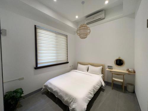 Una cama o camas en una habitación de 宸村民宿