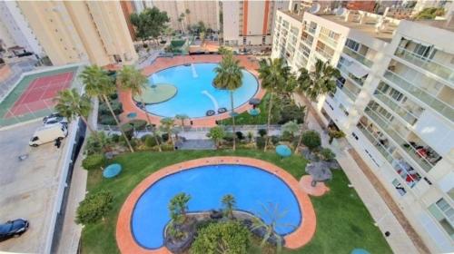 an overhead view of a large swimming pool in a city at VISTAMAR 33 in Benidorm