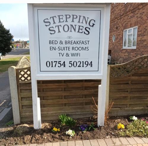a sign for a bed and breakfast inn suite rooms at Stepping Stones in Lincolnshire