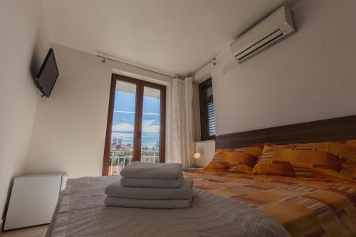 Postel nebo postele na pokoji v ubytování Guesthouse Santin