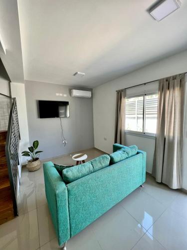 TV a/nebo společenská místnost v ubytování COMPLEJO PALERMO SUITES