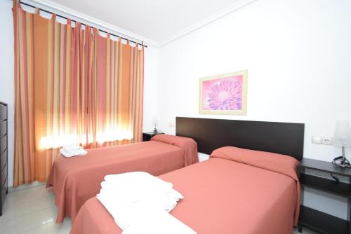 Кровать или кровати в номере Gemelos 26 - Fincas Arena