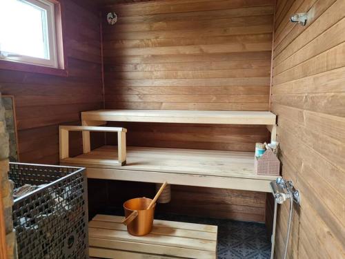 a wooden sauna with two bunk beds in it at Badstue ved elven i Varangerbotn in Varangerbotn