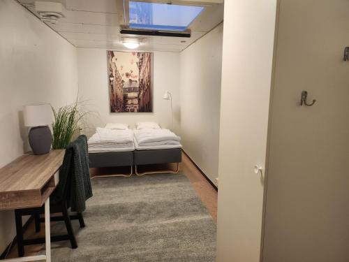 A bed or beds in a room at Vandrarhemmet Eken