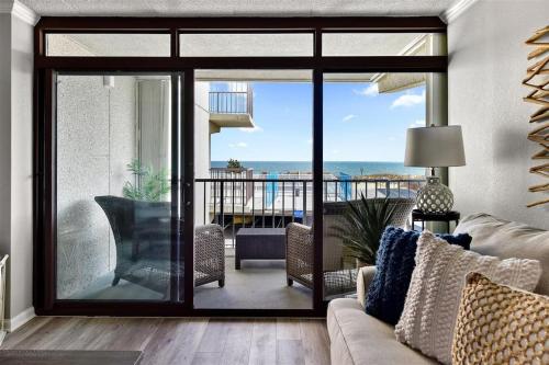 a living room with a view of the ocean at Ocean Front Sea Terrace 209 Heated Pool in Ocean City