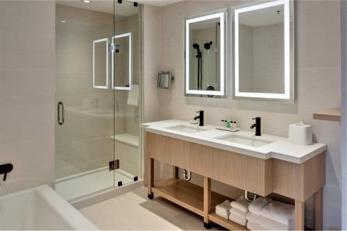 a bathroom with a sink and a shower at Delta Hotels by Marriott Kamloops in Kamloops