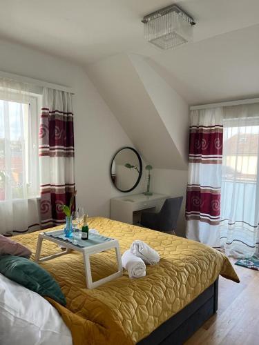 a bedroom with a bed with a table on it at B-Apartment Vienna 12 in Vienna