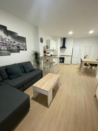 a living room with a couch and a table at Mateos in Murcia