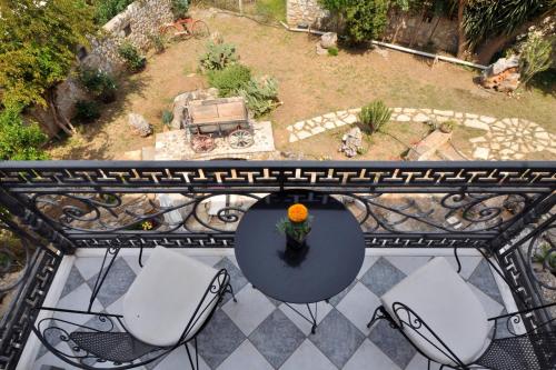 an overhead view of a table and chairs on a balcony at Archontiko Art Hotel in Galaxidhion