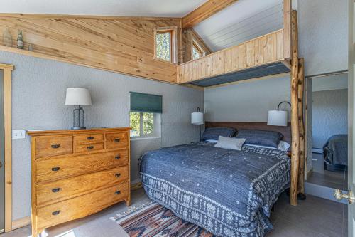 a bedroom with a bed with a wooden bed frame at 3076 W Highway 160 - Guest House in Mancos