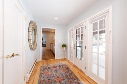 a hallway with a door and a rug at 3076 W Highway 160 - Combo in Mancos