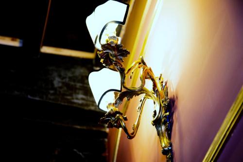 a close up of a gold object on a door at Palazzo Papa Gregorio XVI in Tivoli