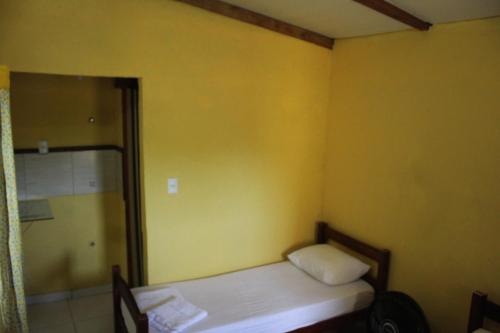 Postel nebo postele na pokoji v ubytování ROSÁRIO TEMPORADA Hostel