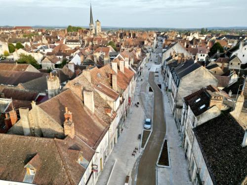 a view of a city with roofs of buildings at Le Thiers in Auxonne
