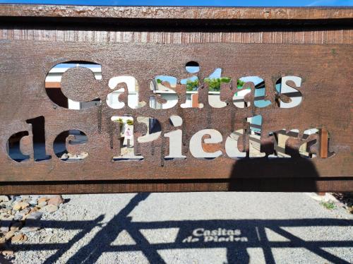 a sign on a wall that readsacsario diehild at Casita de Piedra 10 in Trinidad