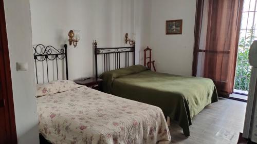 Katil atau katil-katil dalam bilik di Hostal Colon Antequera
