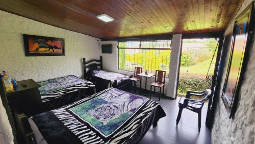 Postel nebo postele na pokoji v ubytování Hospedaje campestre los pinos