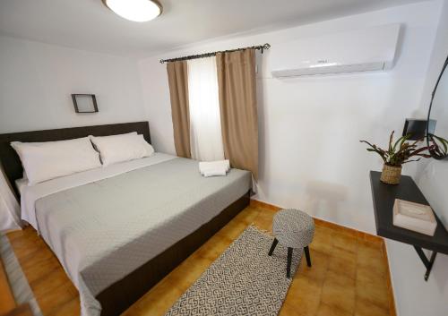 Ένα ή περισσότερα κρεβάτια σε δωμάτιο στο Verano Apartments