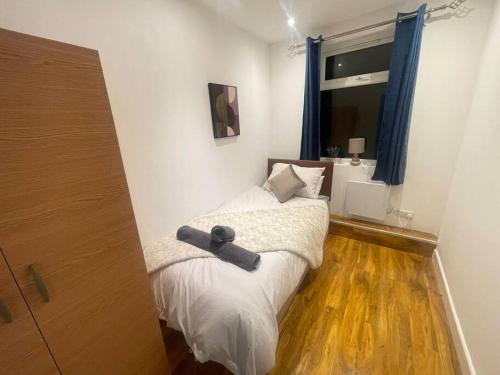 a small bedroom with a bed and a window at Good priced Single Bed Room In Windsor in Old Windsor