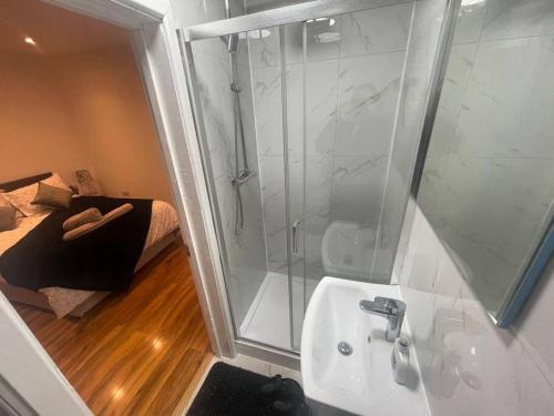 a bathroom with a shower and a sink and a shower at Good priced Single Bed Room In Windsor in Old Windsor