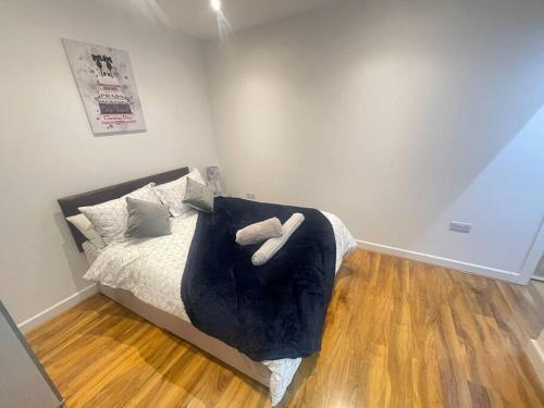 a bedroom with a bed with two stuffed animals on it at Good priced Single Bed Room In Windsor in Old Windsor