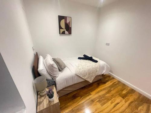 a bedroom with a bed in a white room at Good priced Single Bed Room In Windsor in Old Windsor