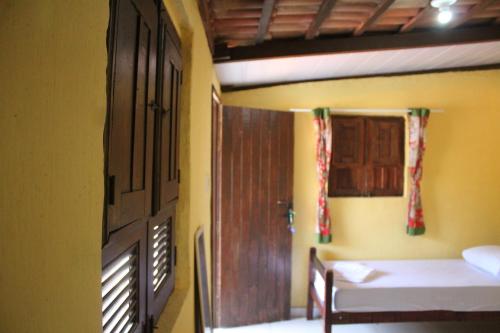 Postel nebo postele na pokoji v ubytování ROSÁRIO TEMPORADA Hostel