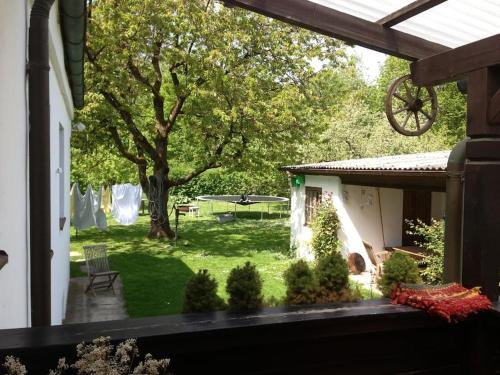 a view of a yard from the porch of a house at Gemütliches Haus mit Holzofen & Garten in Landshut