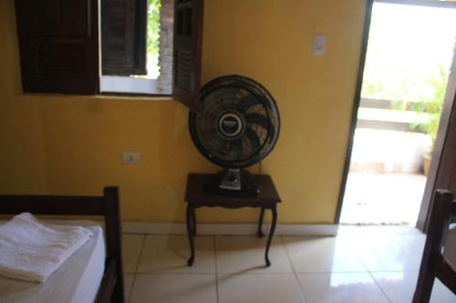 Postel nebo postele na pokoji v ubytování ROSÁRIO TEMPORADA Hostel