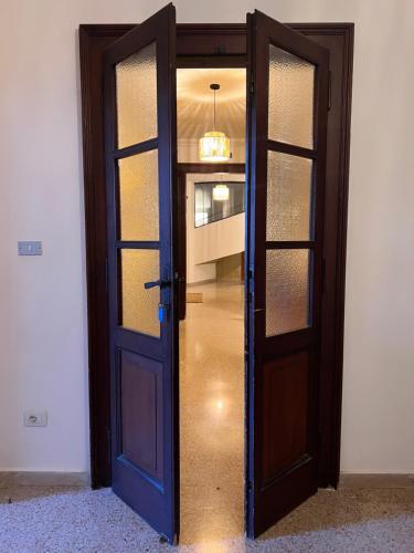 a door that is open to a hallway at Foresteria Santa Maria di Betlem in Foligno