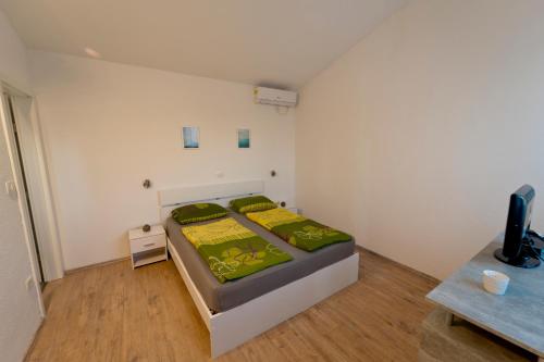 a bedroom with a bed and a tv in it at Villa Luka with private pool near Pula in Pula
