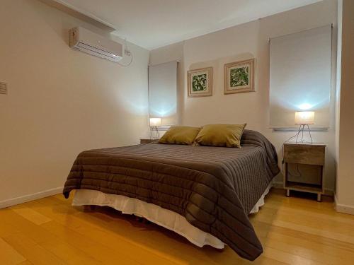 Una cama o camas en una habitación de Plaza suite La Rioja