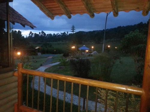a view of a yard from a porch at night at Matisses Hotel & Spa in Santa Rosa de Cabal