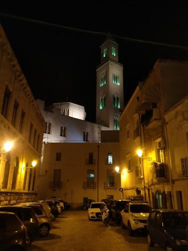 a tall tower with green lights on top of a building at B&B Romeo in Bari