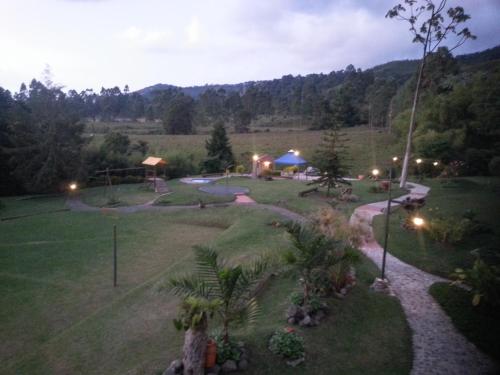 a view of a park at night with a playground at Matisses Hotel & Spa in Santa Rosa de Cabal