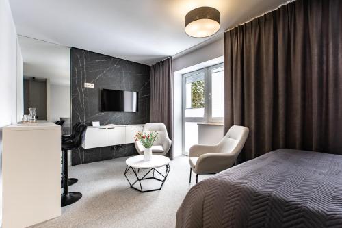 Ένα ή περισσότερα κρεβάτια σε δωμάτιο στο K20 Apartamenty Łódź - Dostęp na Kod