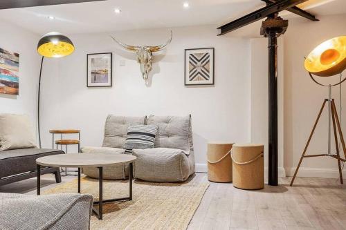 a living room with a couch and a table at Host & Stay - Slater Street Apartments in Liverpool