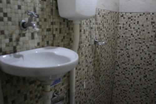 Koupelna v ubytování ROSÁRIO TEMPORADA Hostel
