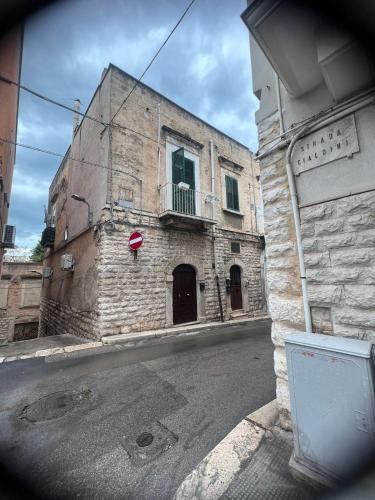 an old stone building on the side of a street at Centrale56 in Bisceglie