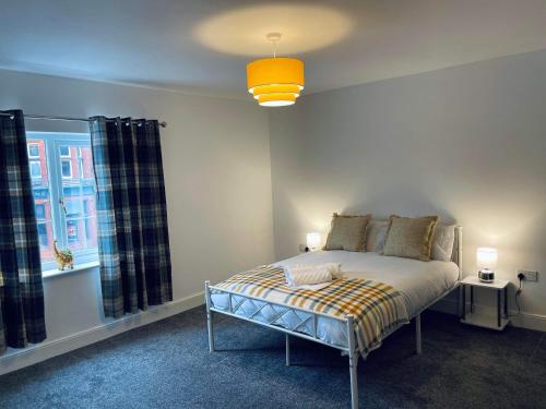 a bedroom with a bed and a window at Railway House - By EazyStays in Crewe