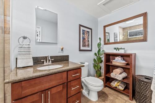 a bathroom with a sink and a toilet at Wailana Sands 206 in Kihei