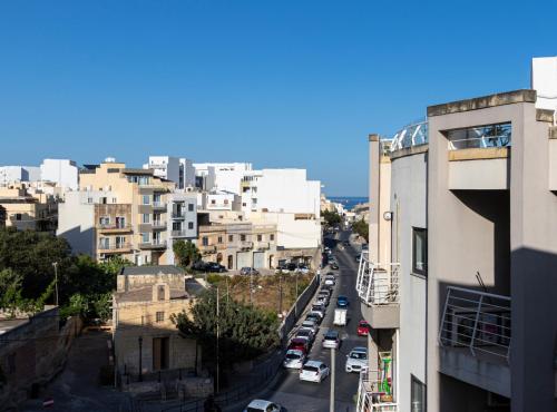 a view of a city street with buildings at H2 -Modern and Spacious 3 Bedroom Apartment in San Ġwann
