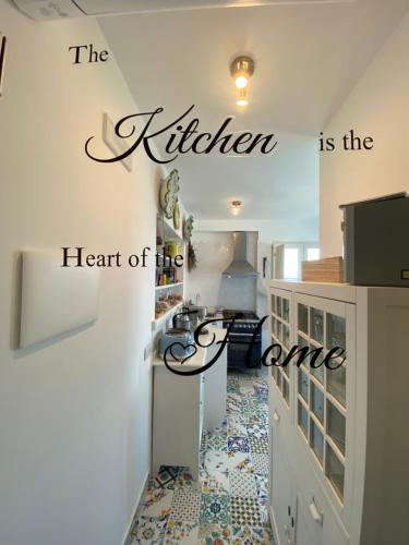 the kitchen is the heart of the home wall art sticker at La Baia di Napoli in Capri