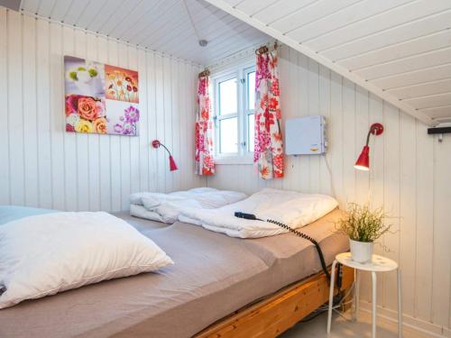 a bedroom with two beds and a window at Holiday home Harboøre XLII in Harboør