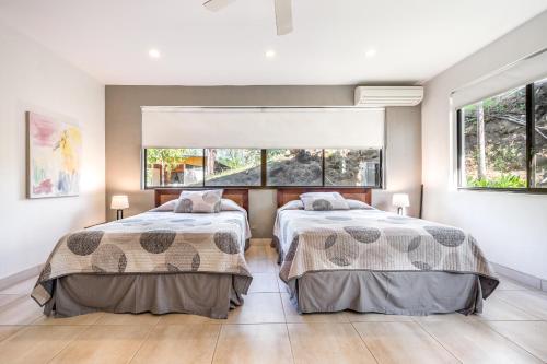 เตียงในห้องที่ Casa Carmen