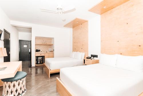 Postel nebo postele na pokoji v ubytování Bahia Hotel & Beach House