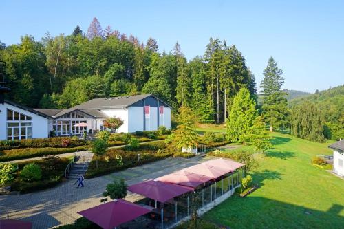 an overhead view of a building with pink umbrellas at Dorint Parkhotel Siegen in Siegen