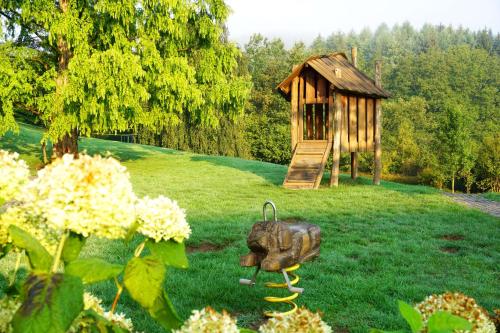 a toy elephant on the grass next to a playground at Dorint Parkhotel Siegen in Siegen