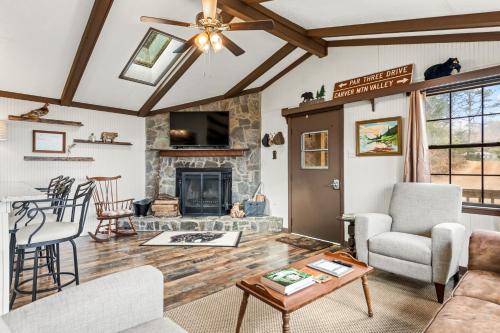 a living room with a couch and a fireplace at Eagle's Nest in Franklin